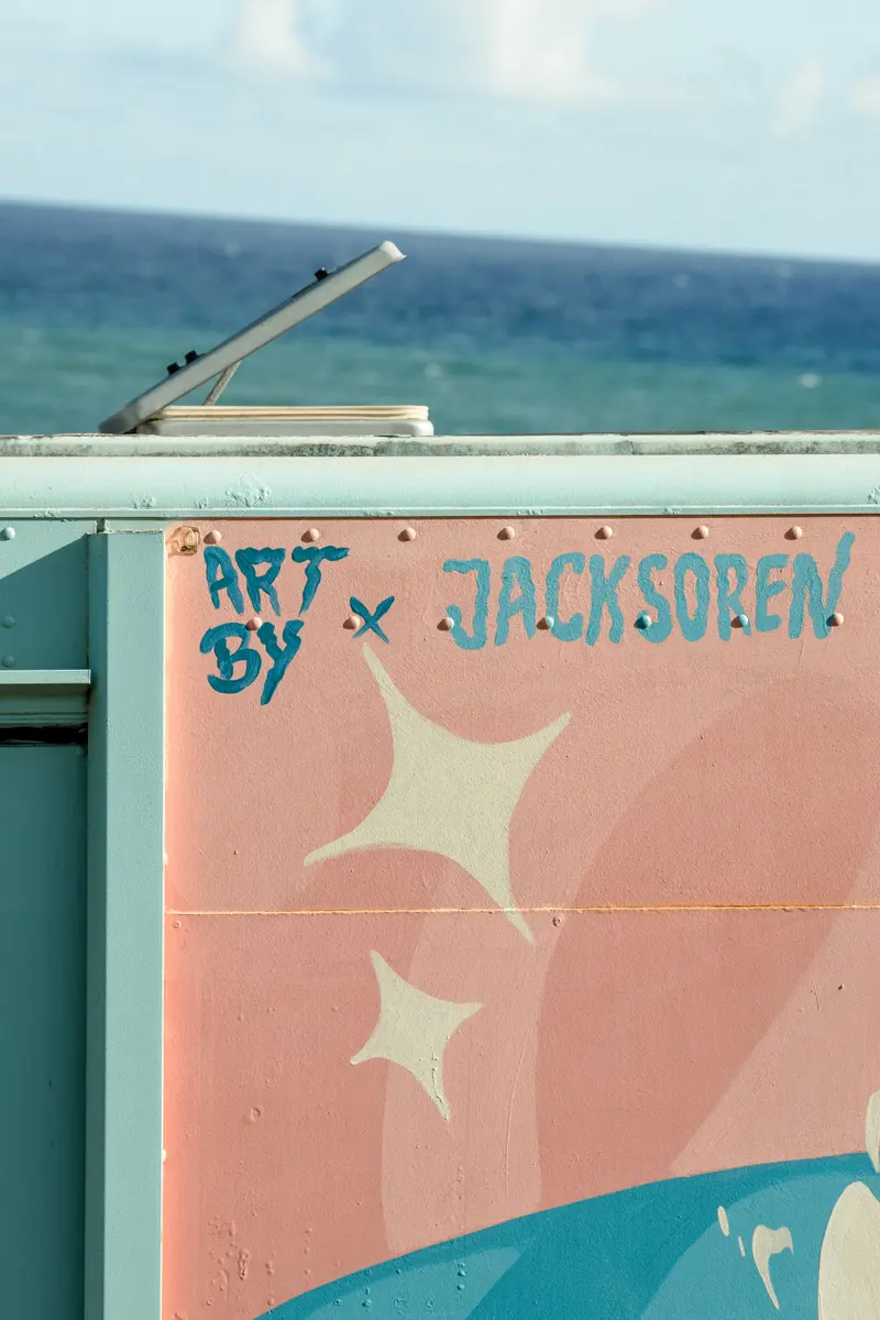 The “Art by Jack Soren” signature on the truck
