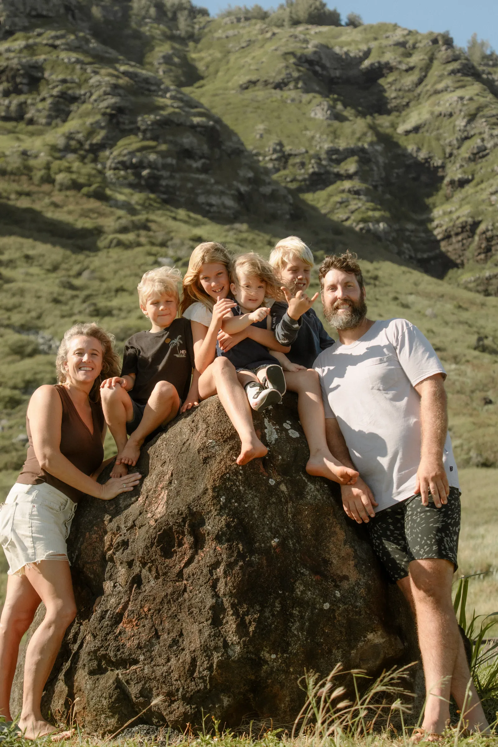 The Smee ohana gathered on a boulder below the mountains